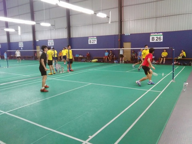 coaching badminton players